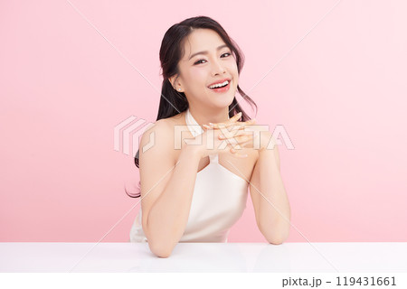 Beautiful young asian woman with clean fresh skin on pink background, Face care, Facial treatment, Cosmetology, beauty and spa, Asian women portrait. Beautiful young asian woman with clean fresh skin on pink background, Face care, Facial treatment, Cosmetology, beauty and spa, Asian women portrait. 119431661