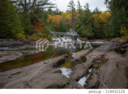 Bridge spanning river along hiking trail at Wilson Falls. 119432128