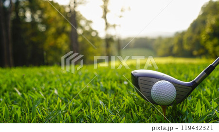 Golf ball and golf club in beautiful golf course at sunset background. 119432321