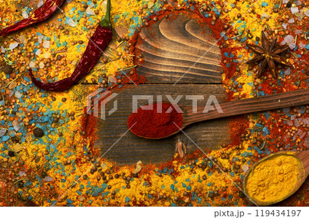 Composition of condiment making heart shape. Wood spoons 119434197