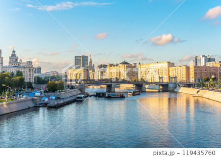 Panoramic view Borodinsky bridge, river Moscow, old buildings and high towers. View of the Borodinsky Bridge and the embankment in Moscow 119435760