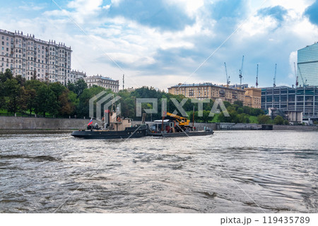 A barge with a tugboat floats along the Moscow River 119435789