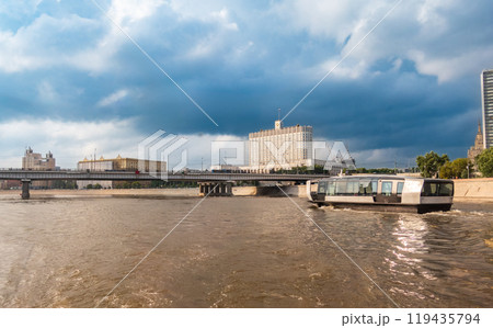 Modern eco-friendly transport: the futuristic river tram runs along the Moskva River. Modern eco-friendly transport: the futuristic river tram runs along the Moskva River. 119435794