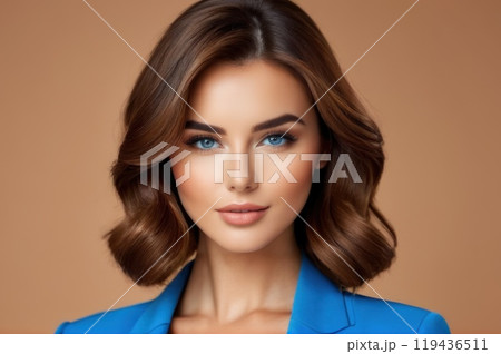 Close-up portrait of beautiful sensual caucasian woman with brown hair wearing blue clothes on a blue background.. AI 119436511