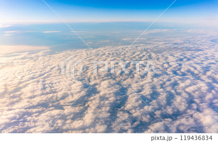 Beautiful orange and pink sunrise over the clouds, view from the plane. 119436834