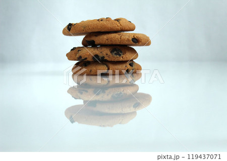 Chocolate chip cookies with chocolate chips on a white light background with space for copyspace text Chocolate chip cookies with chocolate chips on a white light background with space for copyspace text 119437071
