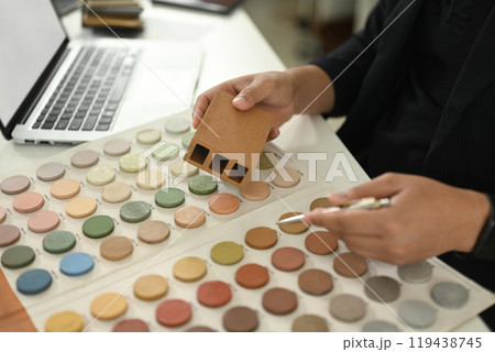 An interior designer working with palette choosing colors for house renovation 119438745