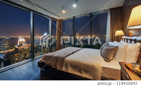 Modern bedroom with cityscape view at night 119438842