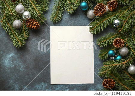 Christmas flat lay gray background with fir tree branches and silver decorations, fir cones and white paper for Free space for design. Holiday concept. Christmas flat lay gray background with fir tree branches and silver decorations, fir cones and white paper for Free space for design. Holiday concept. 119439153