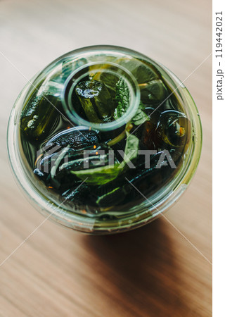 Plastic cup of iced green tea on the table. 119442021