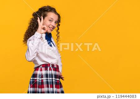 Girl making OK gesture with hand Girl making OK gesture with hand 119444083