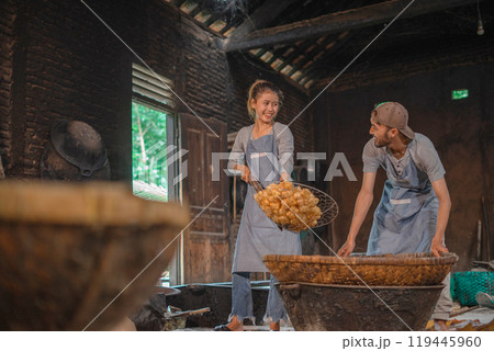 Joyful Artisans Collaborating in a Rustic Workshop with Natural Ingredients Joyful Artisans Collaborating in a Rustic Workshop with Natural Ingredients 119445960