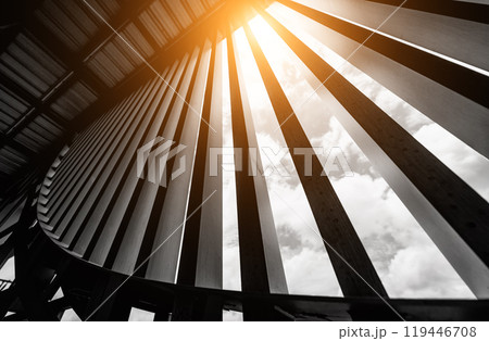 A structure featuring wooden slats on construction site contributing to its architectural style 119446708