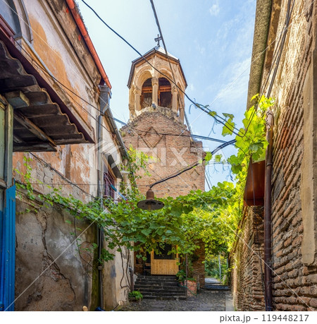 View of the historic Old Town in Tbilisi, Georgia, with shops, trees, and quiet streets 119448217