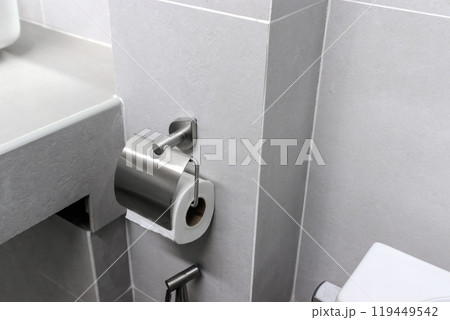 Stainless steel tissue holder in the bathroom Stainless steel tissue holder in the bathroom 119449542