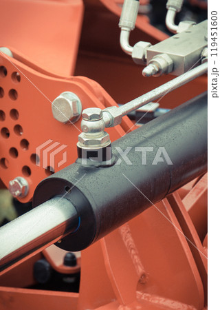 Black piston or actuator in red pneumatic or hydraulic machine. Technology Black piston or actuator in red pneumatic or hydraulic machine. Technology 119451600