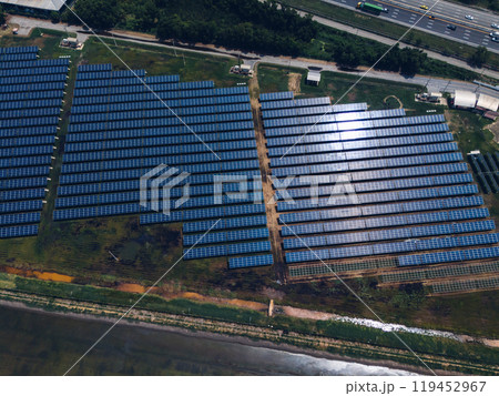 Ecology solar power station panels in the fields green energy . Aerial view of Solar panel, photovoltaic, alternative electricity source. Concept of sustainable resources. 119452967