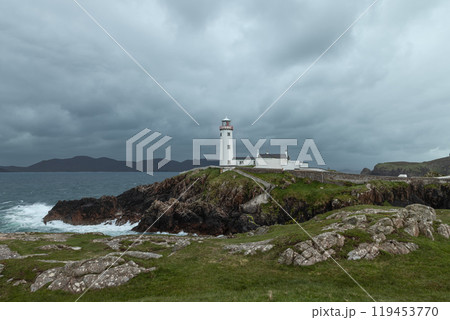 Fanad Head Lighthouse on cliffs with stormy skies and crashing waves along the Irish coast Fanad Head Lighthouse on cliffs with stormy skies and crashing waves along the Irish coast 119453770