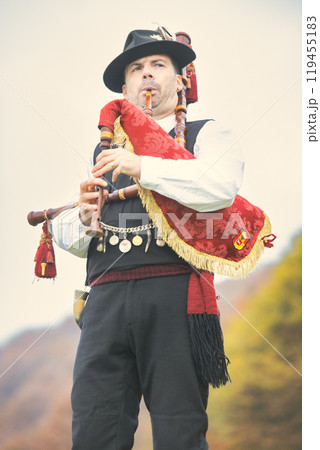 Traditional baguette player from Northern Italy Traditional baguette player from Northern Italy 119455183