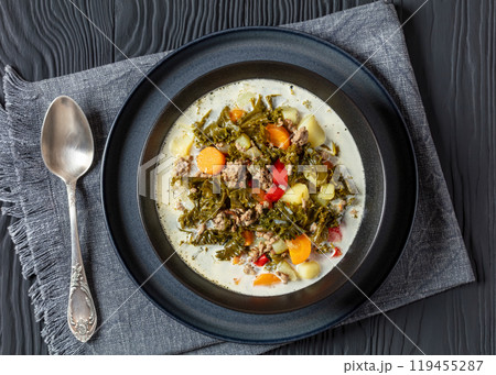 ground beef veggies kale soup in black bowl ground beef veggies kale soup in black bowl 119455287
