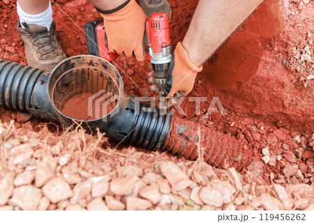 In order to repair damaged drainage system for collecting rainwater, underground storm sewer pipes must be replaced. 119456262