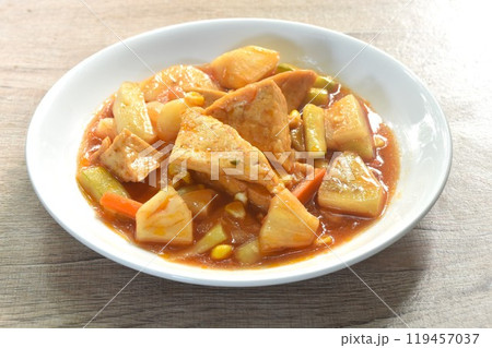 fried tofu with mixed vegetable in sweet and sour gravy sauce vegetarian food on plate fried tofu with mixed vegetable in sweet and sour gravy sauce vegetarian food on plate 119457037
