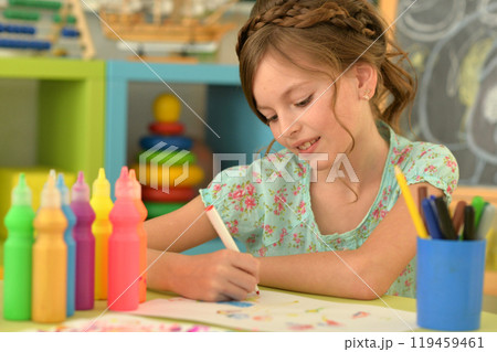 Portrait of cute girl drawing picture at home 119459461