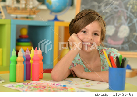 Portrait of cute girl drawing picture at home 119459465