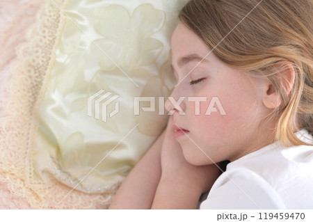 Adorable cute little girl sleeping in bed Adorable cute little girl sleeping in bed 119459470