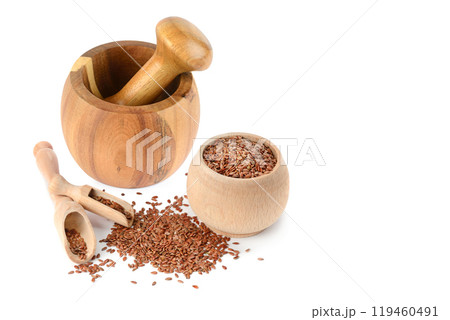 Flax seeds, wooden pestle and mortar isolated on white. Collage. Free space for text. Flax seeds, wooden pestle and mortar isolated on white. Collage. Free space for text. 119460491
