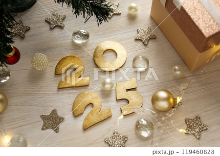 Festive background wit numbers 2025 Christmas tree gift. Greeting card or banner for New Year holidays. Festive background wit numbers 2025 Christmas tree gift. Greeting card or banner for New Year holidays. 119460828