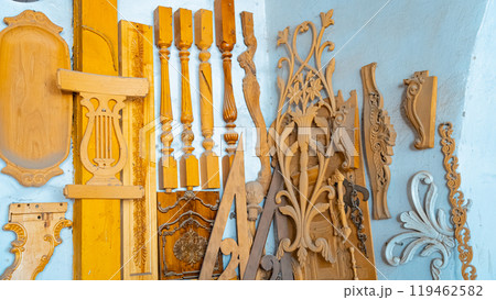 carving element. furniture in classic style. white color wood with gold trim. patina. carving. small depth of field. luxury furniture. use as background. 119462582