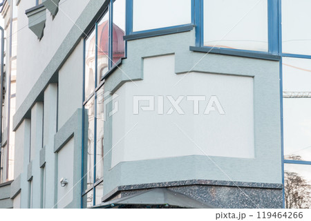 Contemporary Architectural Design of a Modern Building Facade with Reflective Glass Elements Contemporary Architectural Design of a Modern Building Facade with Reflective Glass Elements 119464266