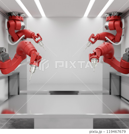 A space on a metallic table surface with red robotic arms surrounding it in a modern factory. 119467679