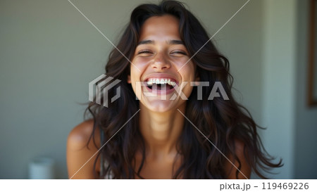 laughing latin american young adult woman with long dark hair laughing latin american young adult woman with long dark hair 119469226
