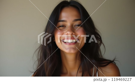 laughing latin american young adult woman with long dark hair 119469227
