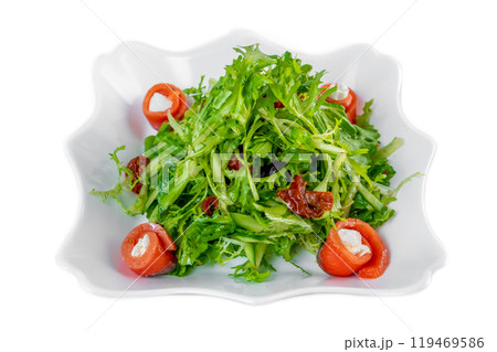 Fresh salad with arugula, salmon, cream cheese and sun-dried tomatoes on white background Fresh salad with arugula, salmon, cream cheese and sun-dried tomatoes on white background 119469586