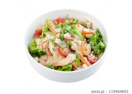 Caesar salad with shrimps on white background top view Caesar salad with shrimps on white background top view 119469601