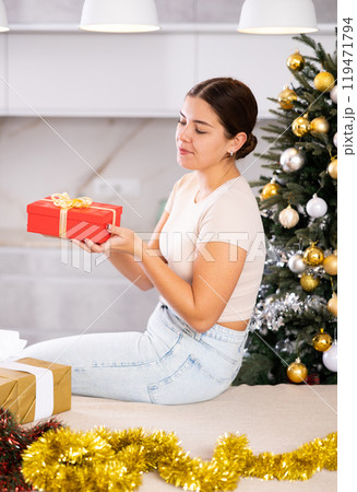 prepearing for New Year and preparing surprises, girl picked up most beautiful gift 119471794