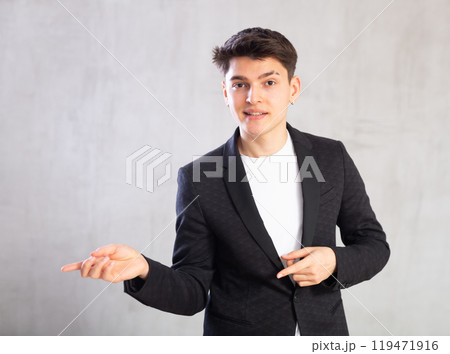 Portrait of smiling young guy in business clothes 119471916