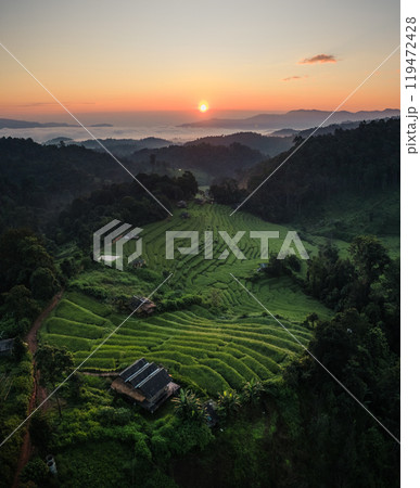 Aerial view of the rice fields,Rice fields and mountains in the early morning Aerial view of the rice fields,Rice fields and mountains in the early morning 119472428
