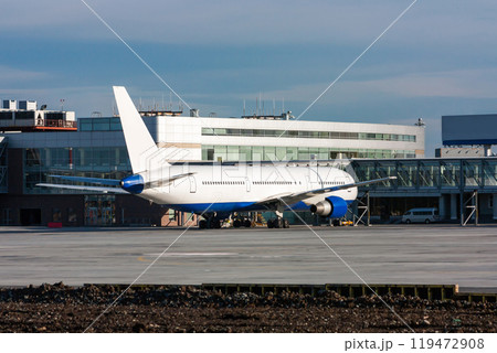 Passenger aircraft in the parking lot near the airport terminal building 119472908