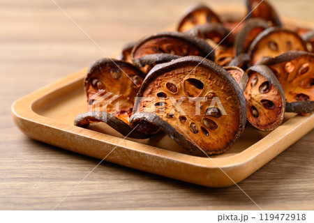 Dried Bael fruit on wooden plate, Herbal drink ingredient 119472918