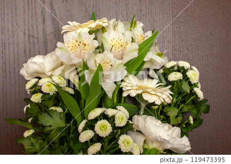 Wrapped white eustoma flowers bouquet. 119473395