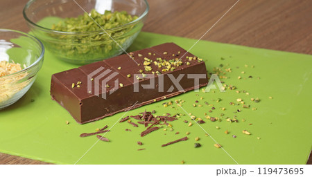 Dubai chocolate with pistachio paste and kataifi dough. Confectionery food and sweets with your own hands at home in the kitchen. 119473695