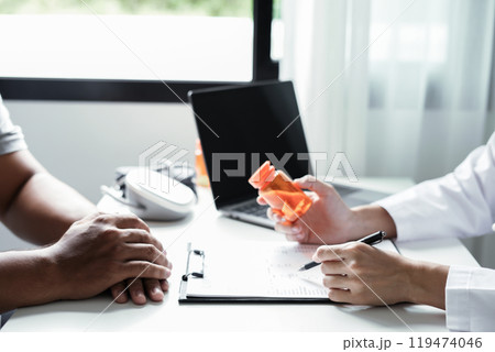 Female doctors who treat patients make an appointment to listen to the results after a physical examination and explain medical information and diagnose the disease. Medical concepts and good health 119474046