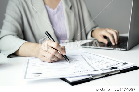 Business woman employer holding resume hiring recruit looking cv resume to hire candidates, analyzing information before job interview. Recruitment concepts Business woman employer holding resume hiring recruit looking cv resume to hire candidates, analyzing information before job interview. Recruitment concepts 119474087