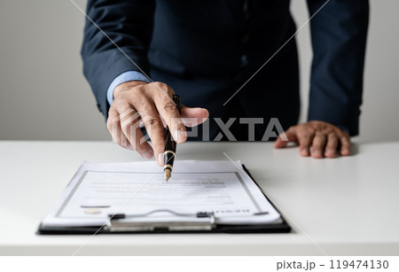 Business man employer holding resume hiring recruit looking cv resume to hire candidates, analyzing information before job interview. Recruitment concepts 119474130