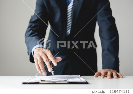 Business man employer holding resume hiring recruit looking cv resume to hire candidates, analyzing information before job interview. Recruitment concepts 119474131