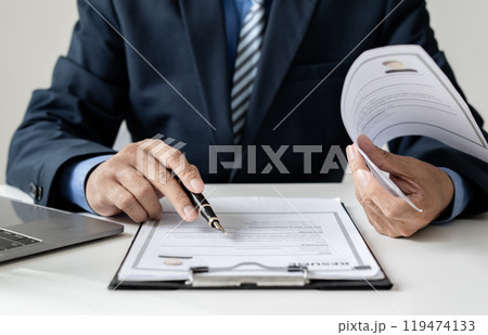 Business man employer holding resume hiring recruit looking cv resume to hire candidates, analyzing information before job interview. Recruitment concepts 119474133